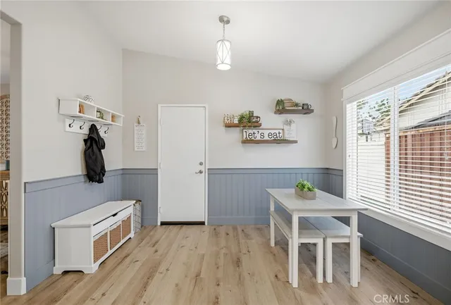 a room with a window and a wooden floor