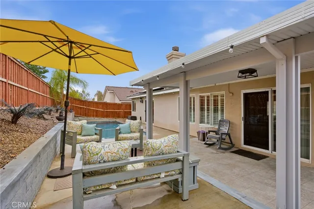 a view of small house with backyard