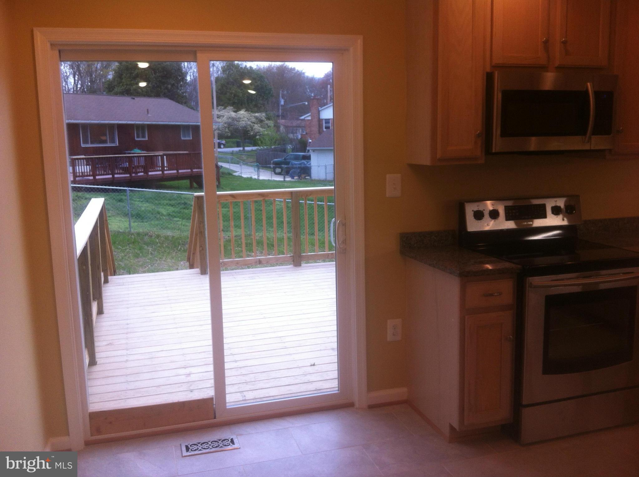 211 Manning Road East Accokeek, MD 20607 - Photo 14 of 30 Kitchen / Glass Doors to Deck