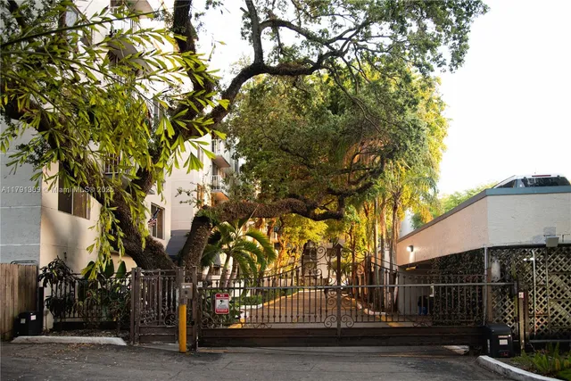 a view of a house with a tree