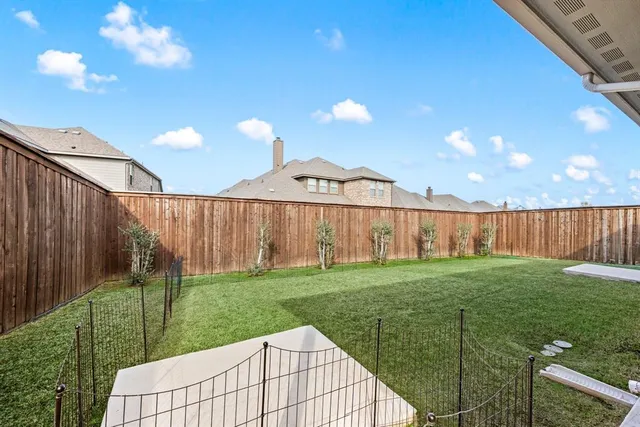 a view of a backyard with a garden