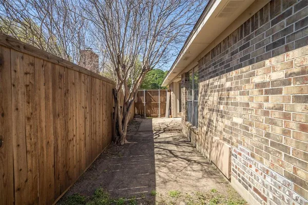 a view of a pathway with a patio