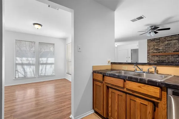a kitchen that has a sink and a window