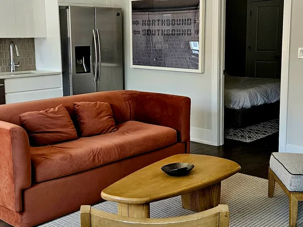 a view of a dining room with furniture and window