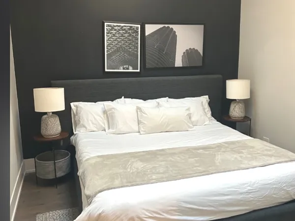 a bathroom with a double vanity sink toilet and shower