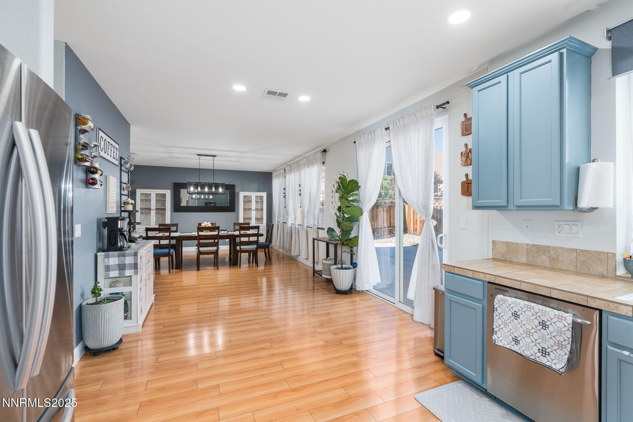 7220 Windswept Loop Sparks, NV 89436 - Photo 11 of 35 a living room with furniture and a wooden floor