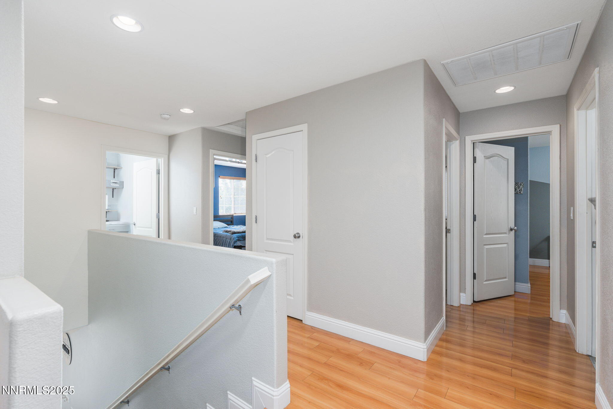7220 Windswept Loop Sparks, NV 89436 - Photo 18 of 35 a view of hallway and kitchen with wooden floor