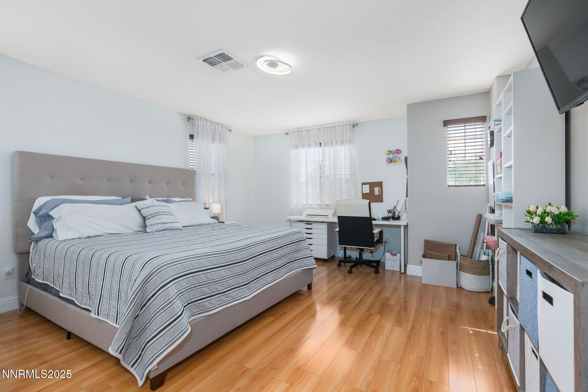 7220 Windswept Loop Sparks, NV 89436 - Photo 20 of 35 a bed room with a bed and a chair