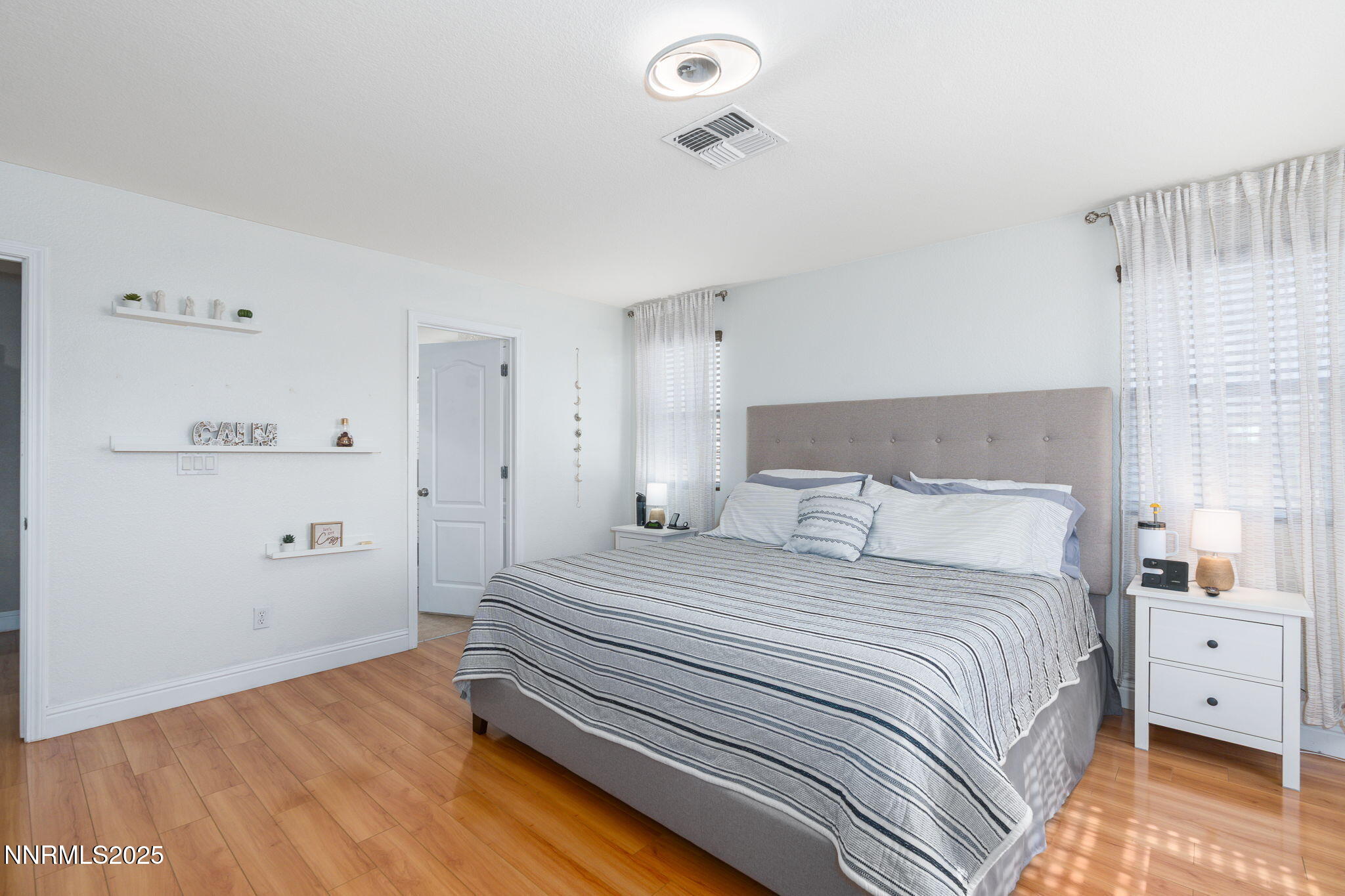 7220 Windswept Loop Sparks, NV 89436 - Photo 22 of 35 a bedroom with a bed and a window