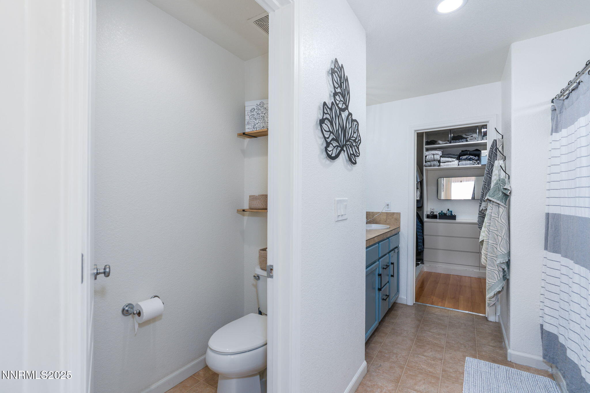 7220 Windswept Loop Sparks, NV 89436 - Photo 23 of 35 a bathroom with a toilet and a shower