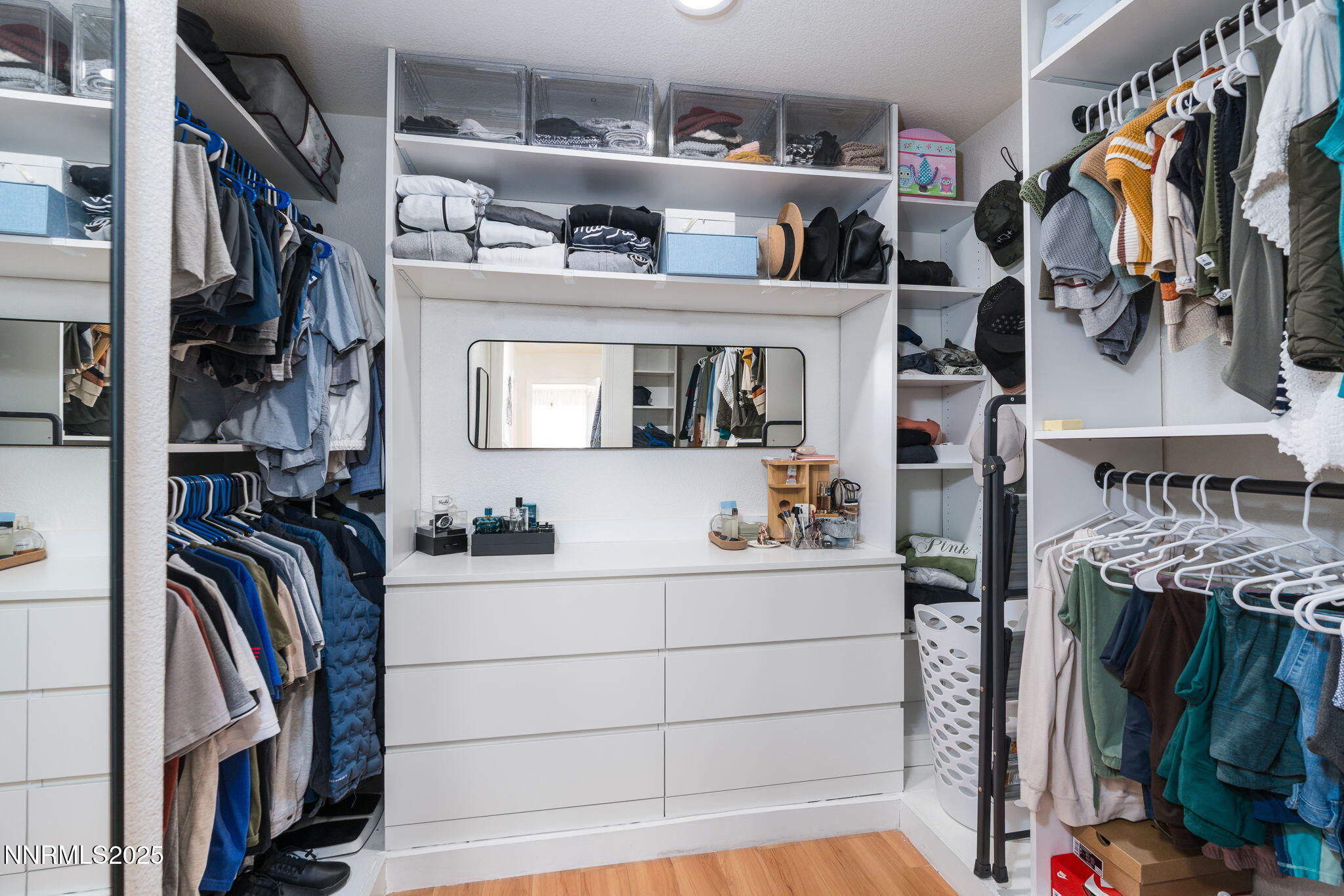7220 Windswept Loop Sparks, NV 89436 - Photo 25 of 35 a view of walk in closet with clothes and shoes