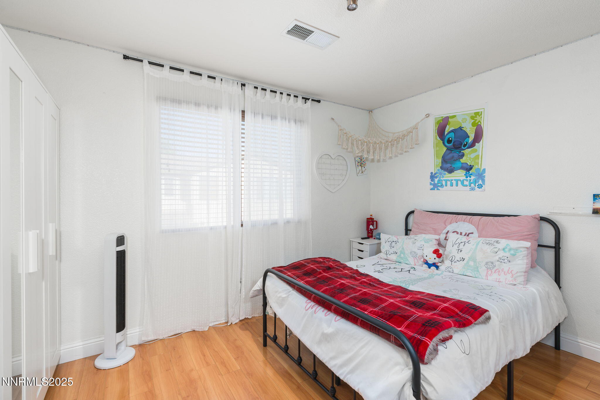 7220 Windswept Loop Sparks, NV 89436 - Photo 27 of 35 a bedroom with a bed and a dresser