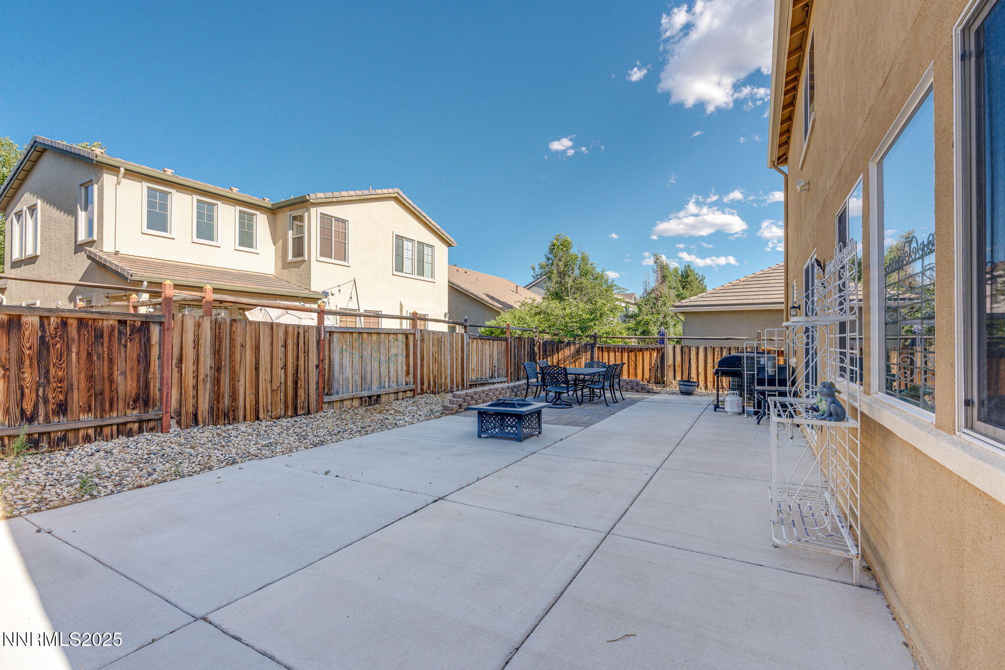 7220 Windswept Loop Sparks, NV 89436 - Photo 34 of 35 a view of a patio with table and chairs and potted plants