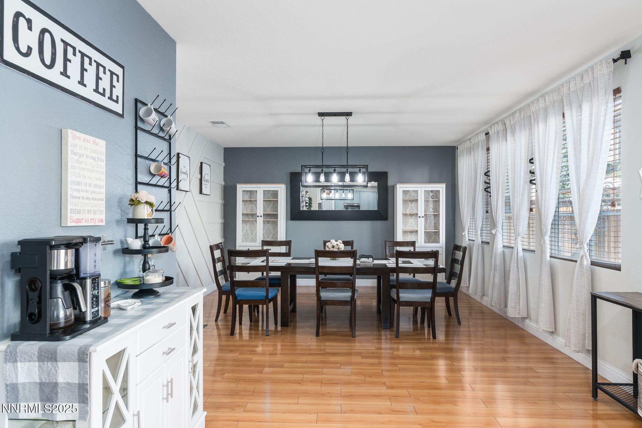 7220 Windswept Loop Sparks, NV 89436 - Photo 8 of 35 a view of a dining room with furniture and chandelier