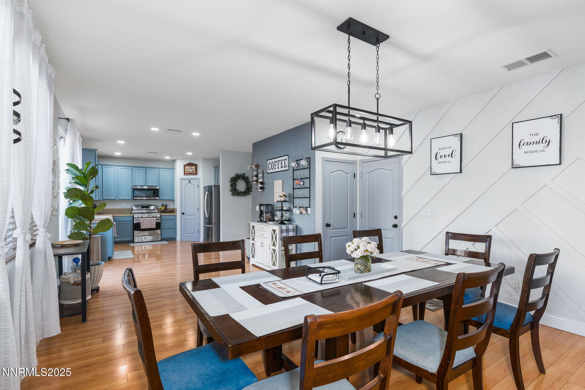 7220 Windswept Loop Sparks, NV 89436 - Photo 10 of 35 a view of a dining room with furniture wooden floor and a chandelier