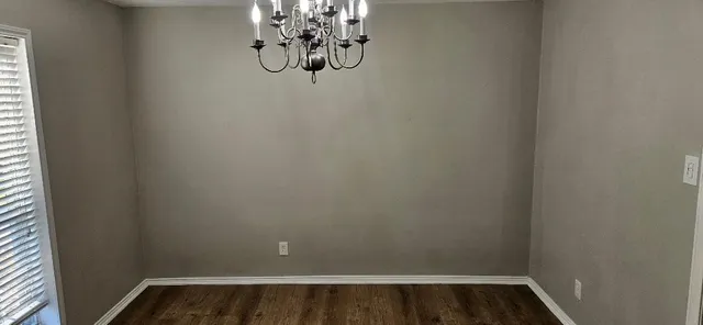 a bathroom with a tub and shower