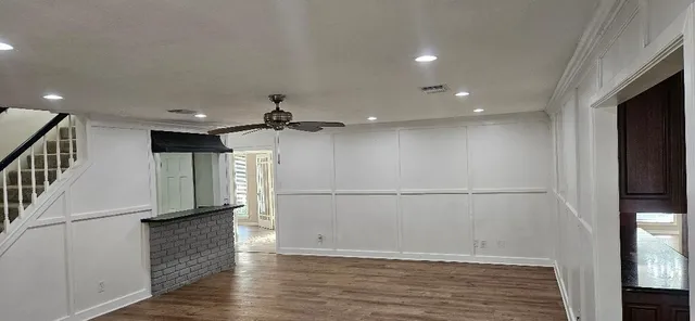 a kitchen with stainless steel appliances granite countertop a stove a refrigerator and a microwave