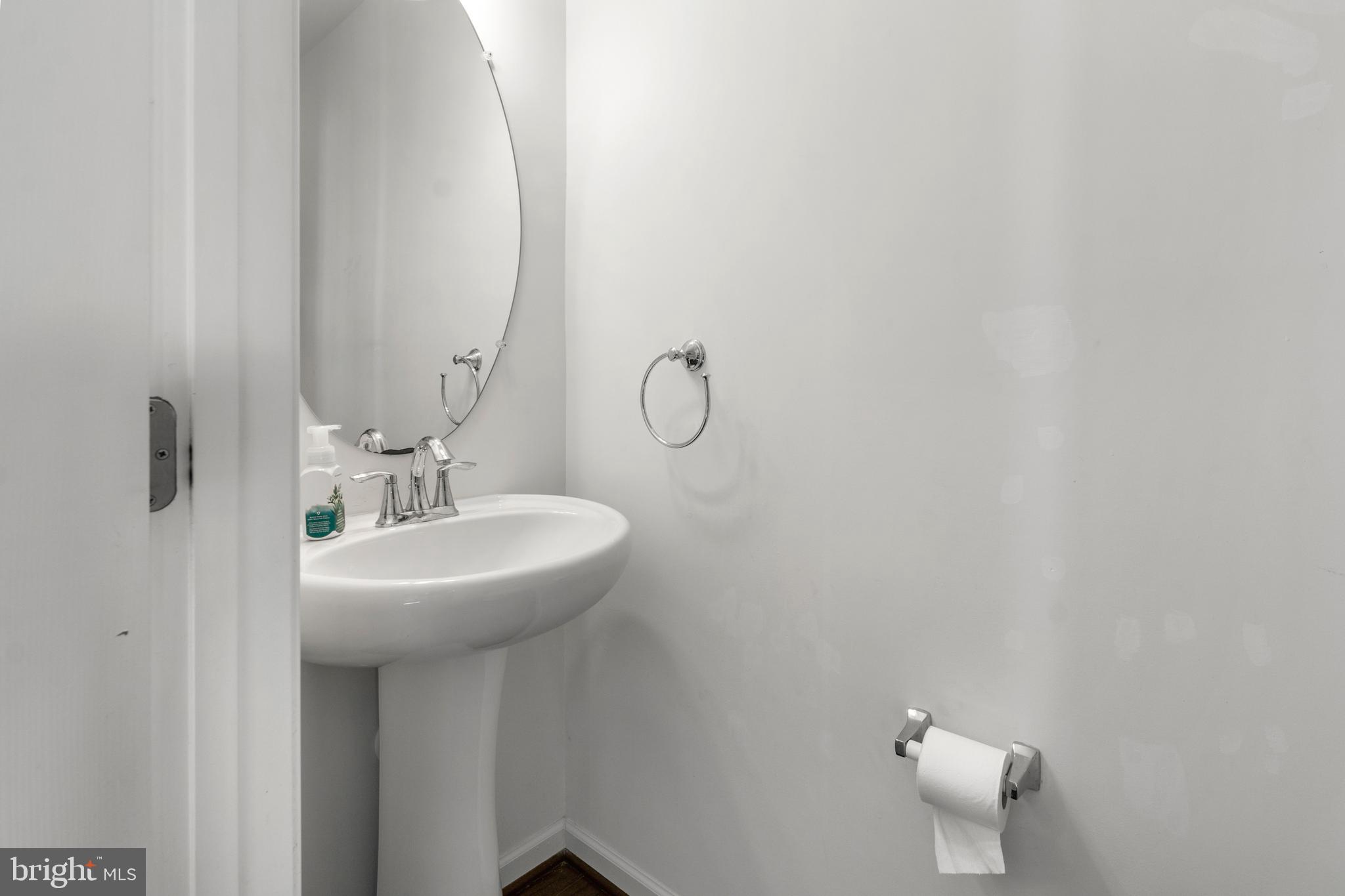 1342 Millar Road Aberdeen, MD 21001 - Photo 15 of 34 a bathroom with a sink a mirror and shower curtain