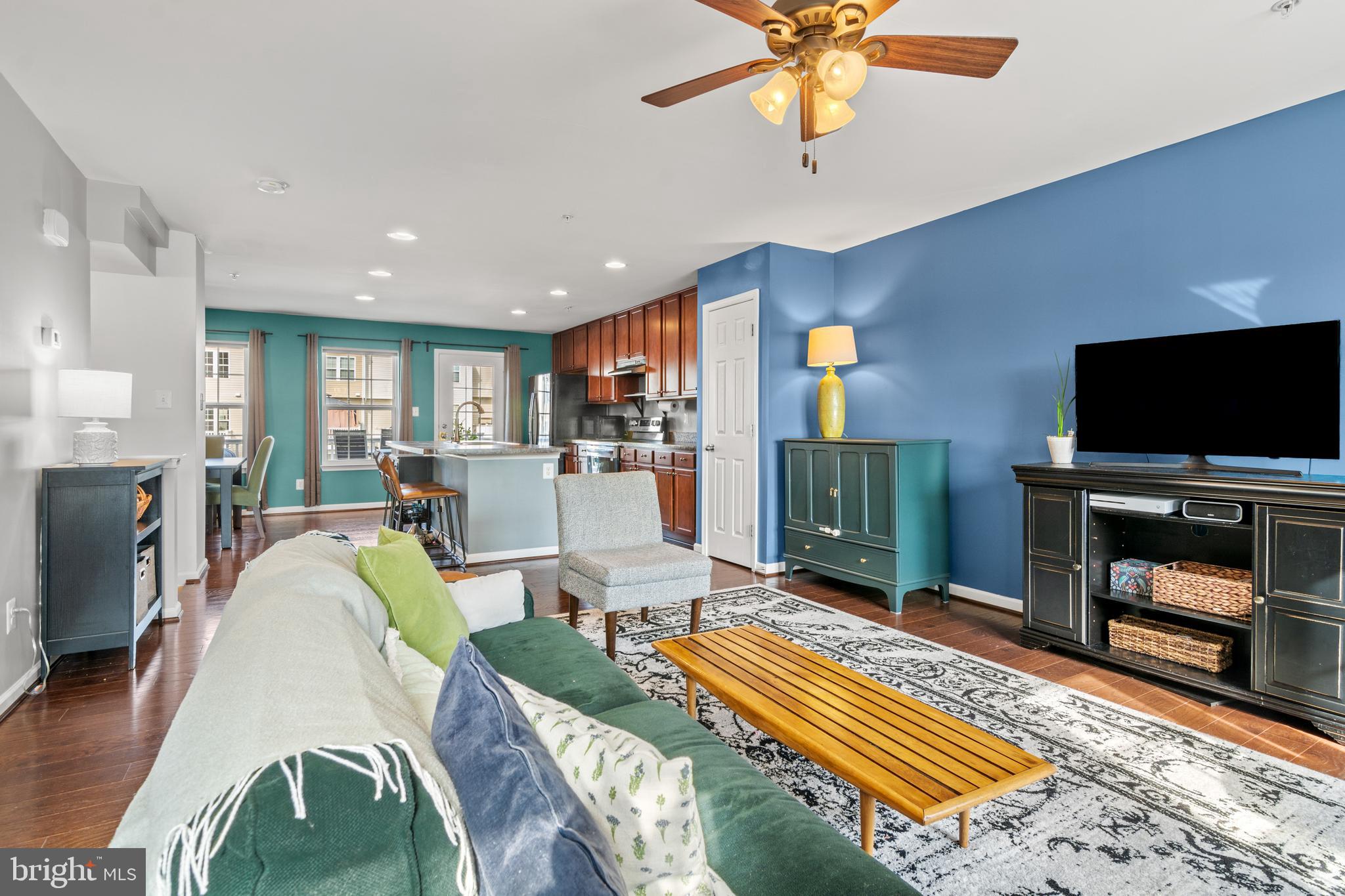 1342 Millar Road Aberdeen, MD 21001 - Photo 18 of 34 a living room with furniture a flat screen tv and a table