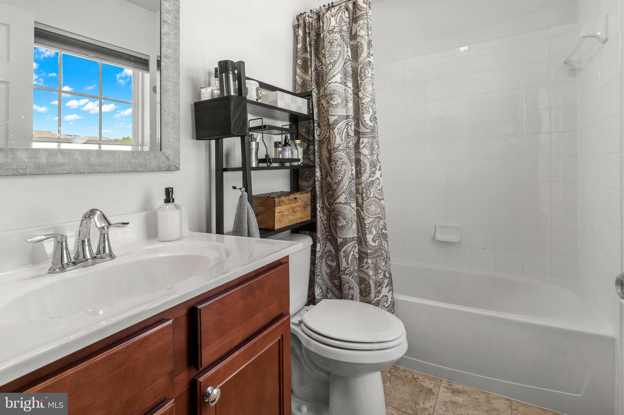 1342 Millar Road Aberdeen, MD 21001 - Photo 22 of 34 a bathroom with a sink a toilet and shower