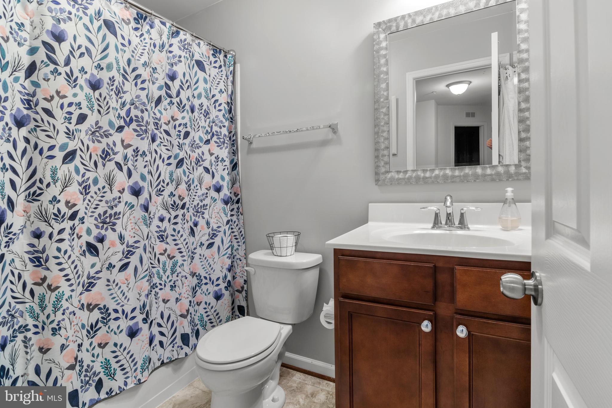 1342 Millar Road Aberdeen, MD 21001 - Photo 25 of 34 a bathroom with a sink toilet and mirror