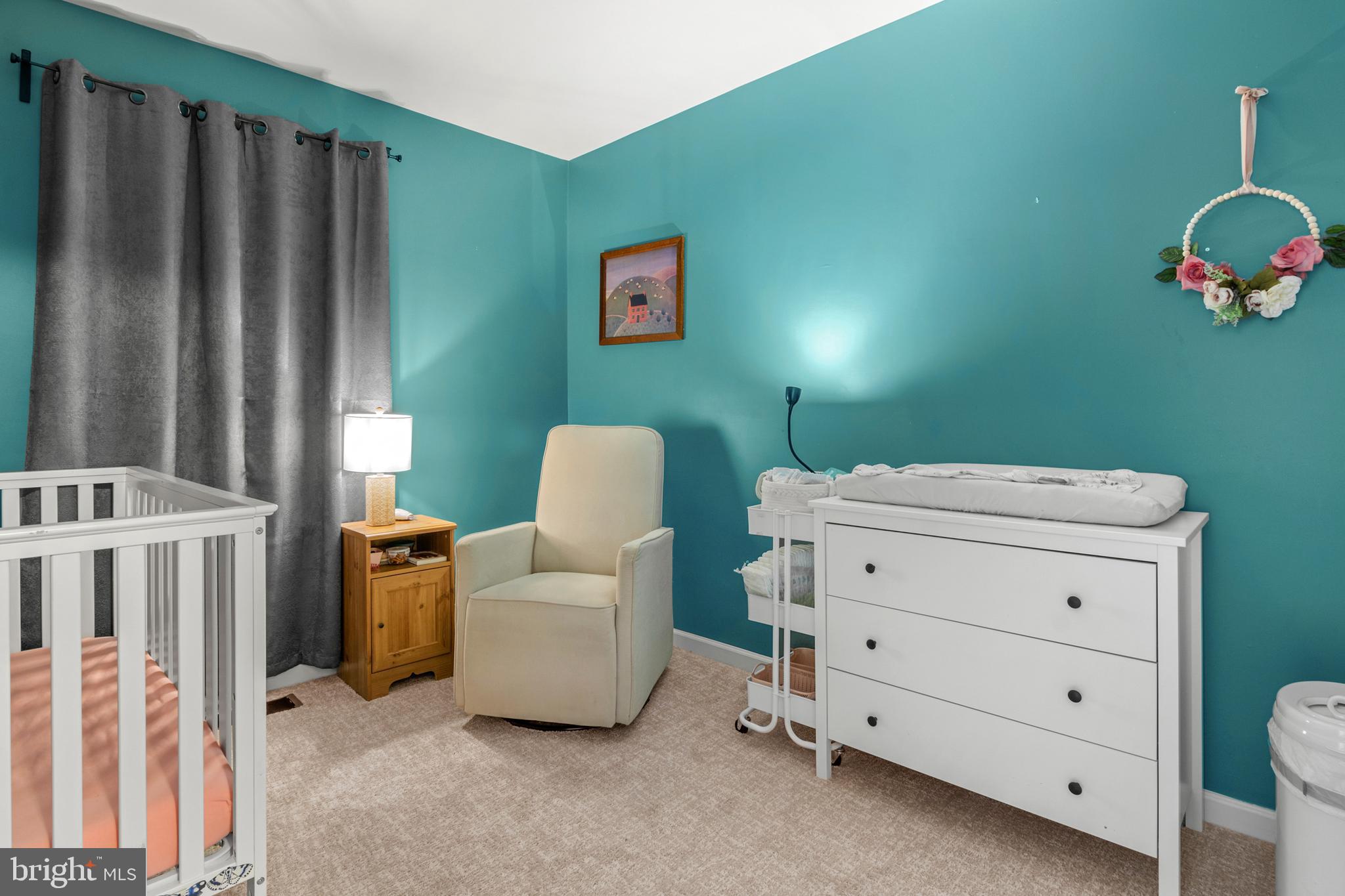 1342 Millar Road Aberdeen, MD 21001 - Photo 26 of 34 a living room with furniture and a baby crib