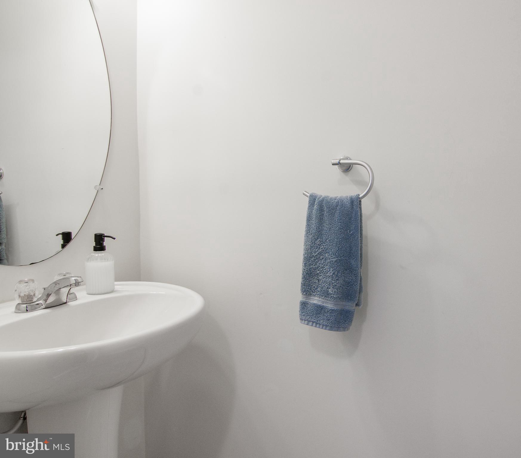 1342 Millar Road Aberdeen, MD 21001 - Photo 29 of 34 a bathroom with a sink and a mirror