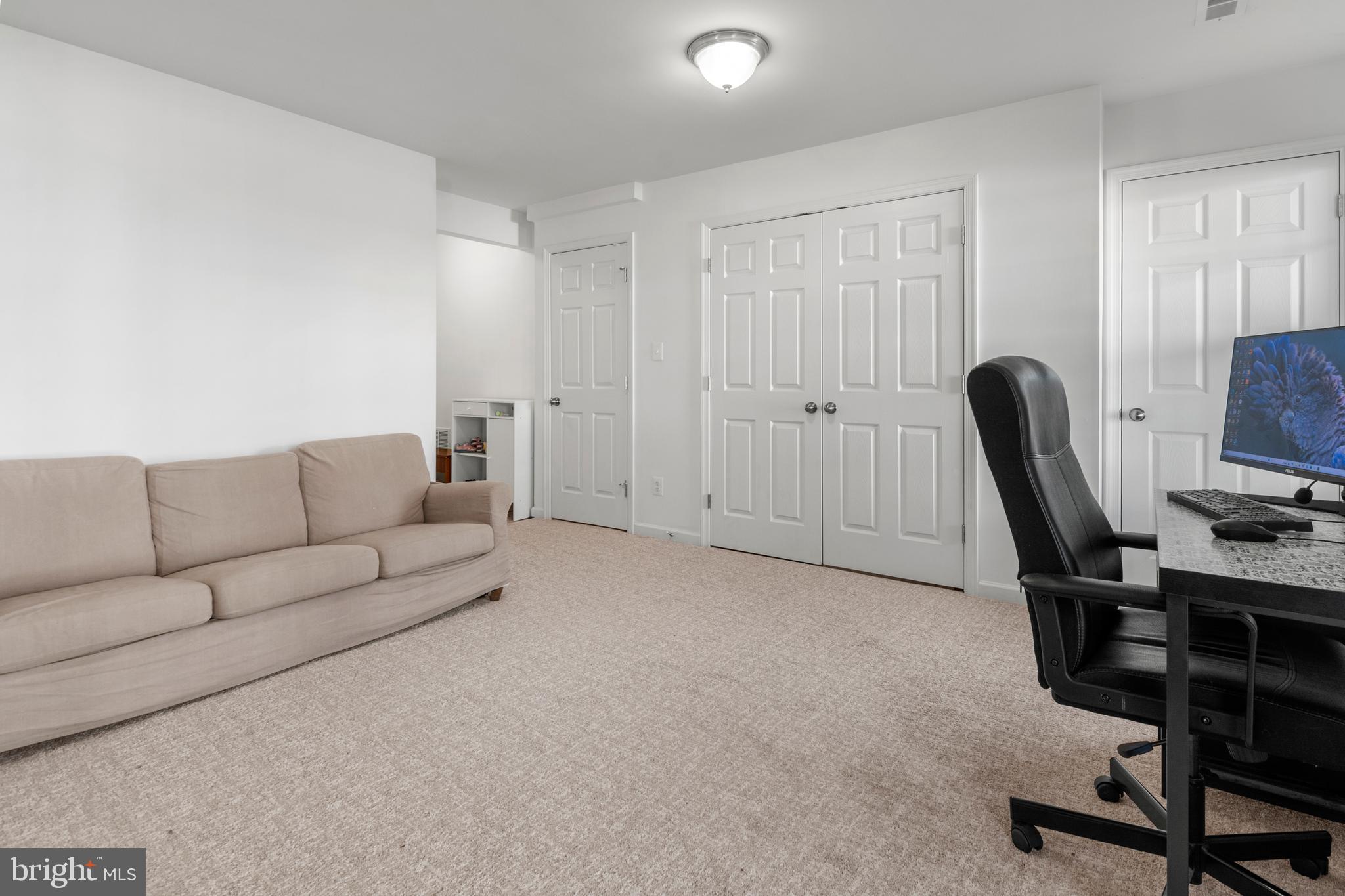 1342 Millar Road Aberdeen, MD 21001 - Photo 31 of 34 a living room with furniture a flat screen tv and a window