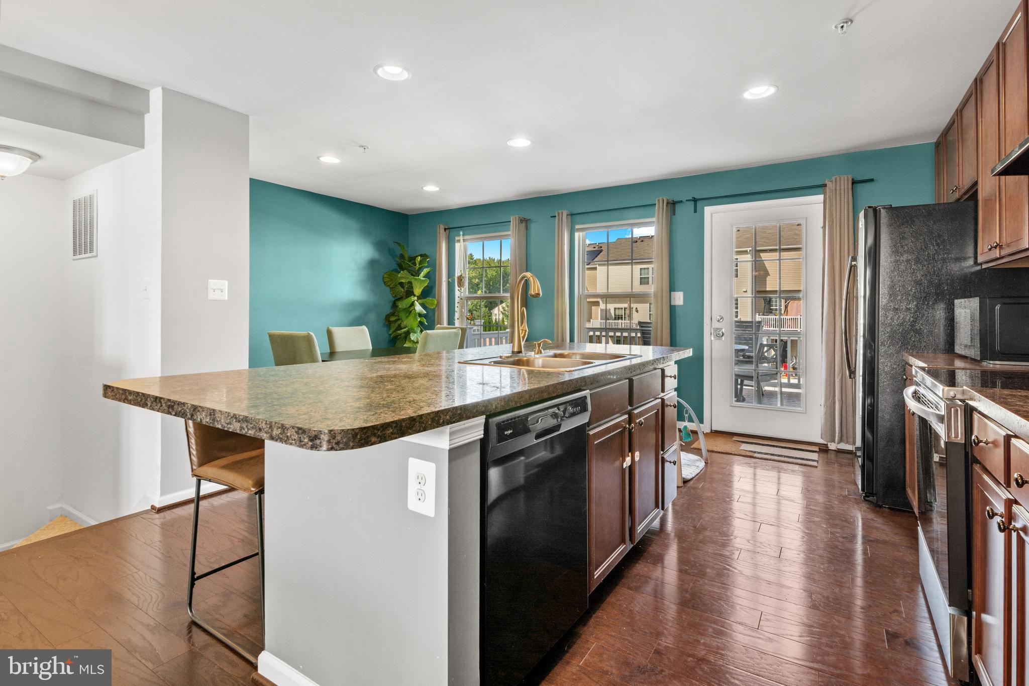 1342 Millar Road Aberdeen, MD 21001 - Photo 6 of 34 a kitchen with stainless steel appliances granite countertop a stove and a kitchen island