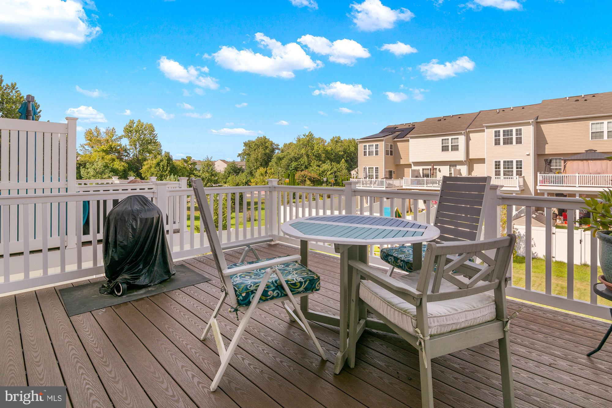 1342 Millar Road Aberdeen, MD 21001 - Photo 10 of 34 a view of a deck with table and chairs with wooden floor and fence
