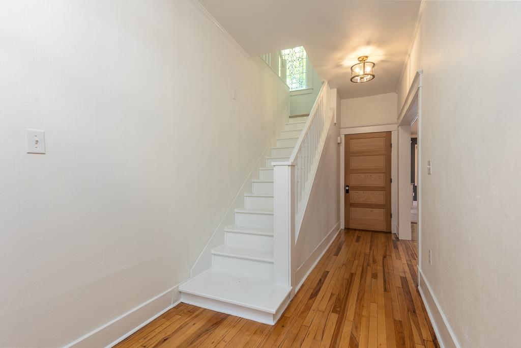 119 South Fenwick Road Memphis, TN 38111 - Photo 26 of 28 a view of a livingroom with wooden floor and stairs