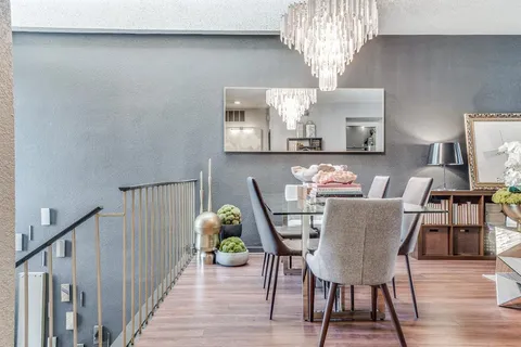 a kitchen with stainless steel appliances a sink window and cabinets
