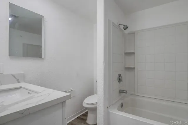 a bathroom with a sink toilet and bathtub