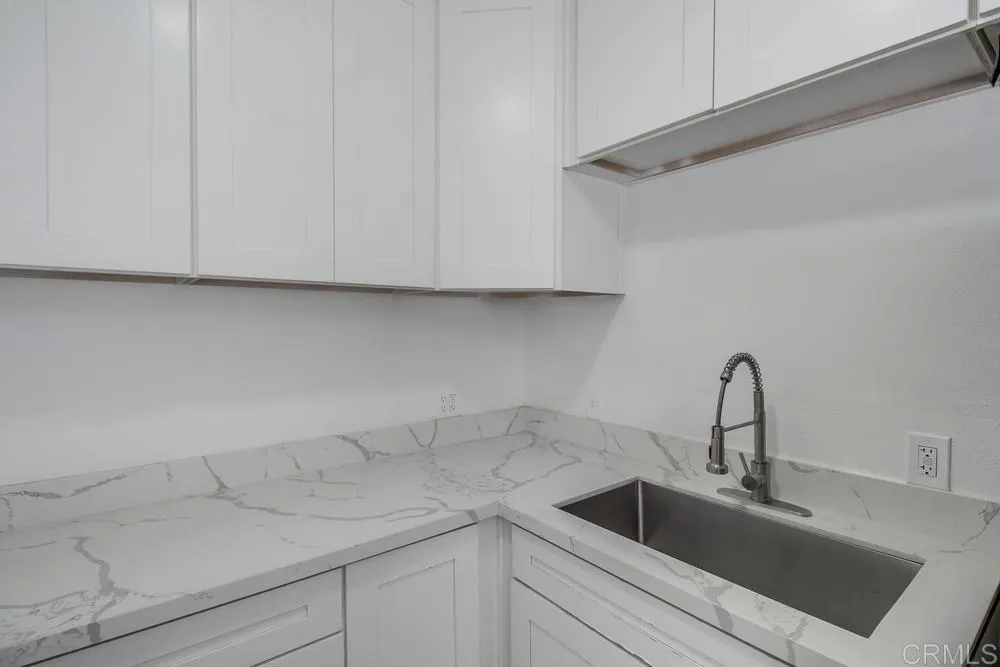 734 Grand Avenue Spring Valley, CA 91977 - Photo 20 of 33 a kitchen with a sink and cabinets