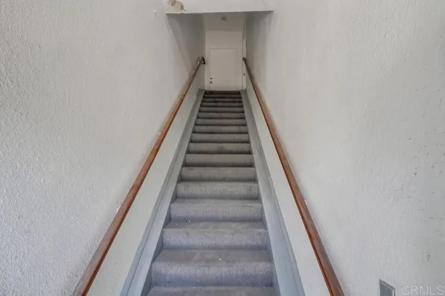 a front view of a house with parking space