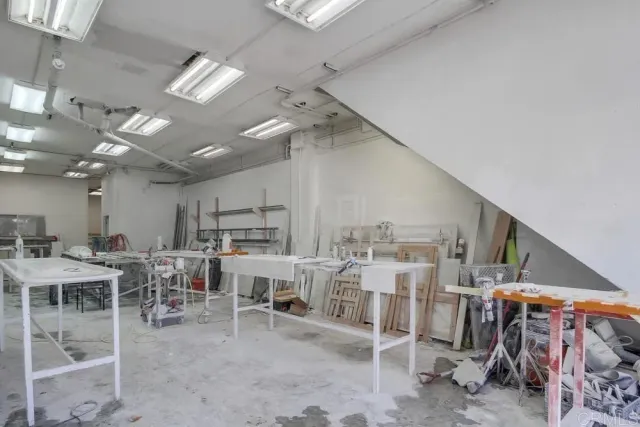 a large room with lots of wooden furniture and a view of living room