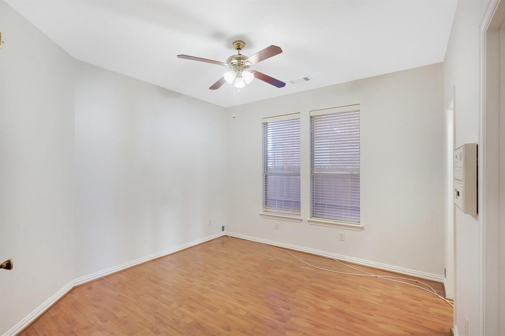 9618 Peach Tree Lane Rowlett, TX 75089 - Photo 11 of 40 wooden floor in an empty room with a window