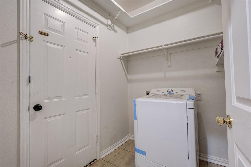 9618 Peach Tree Lane Rowlett, TX 75089 - Photo 28 of 40 a utility room with dryer and washer