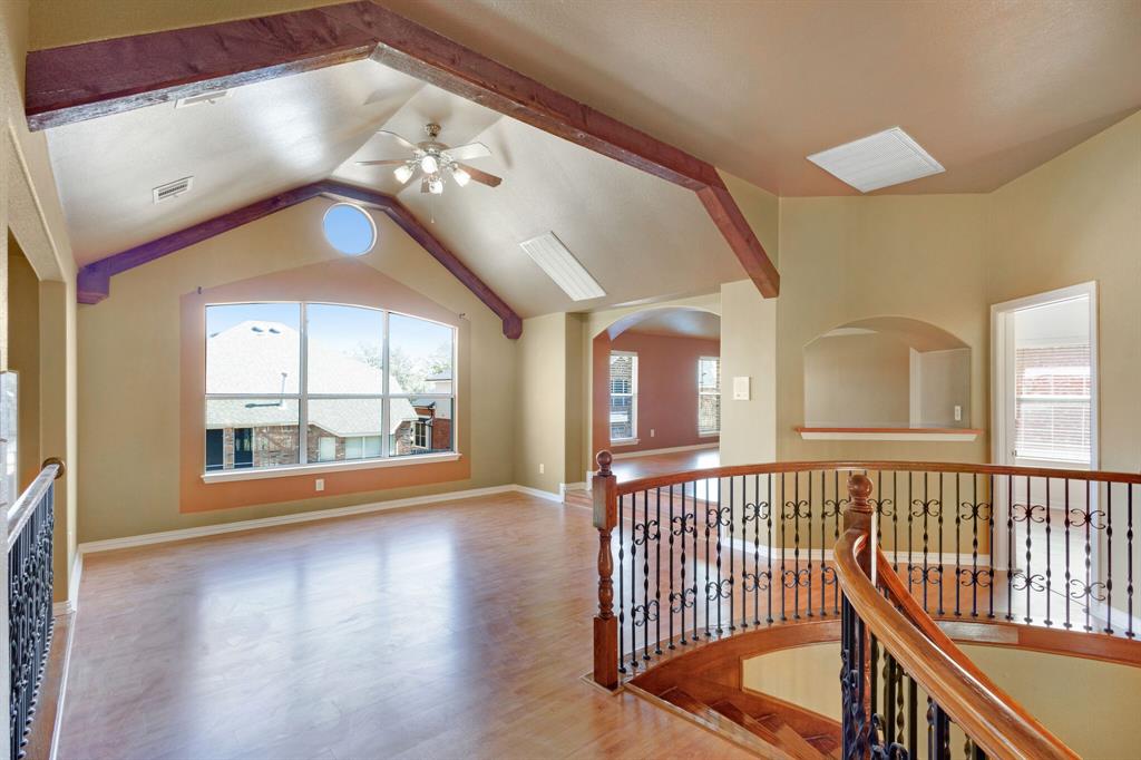 9618 Peach Tree Lane Rowlett, TX 75089 - Photo 29 of 40 an empty room with wooden floor and windows