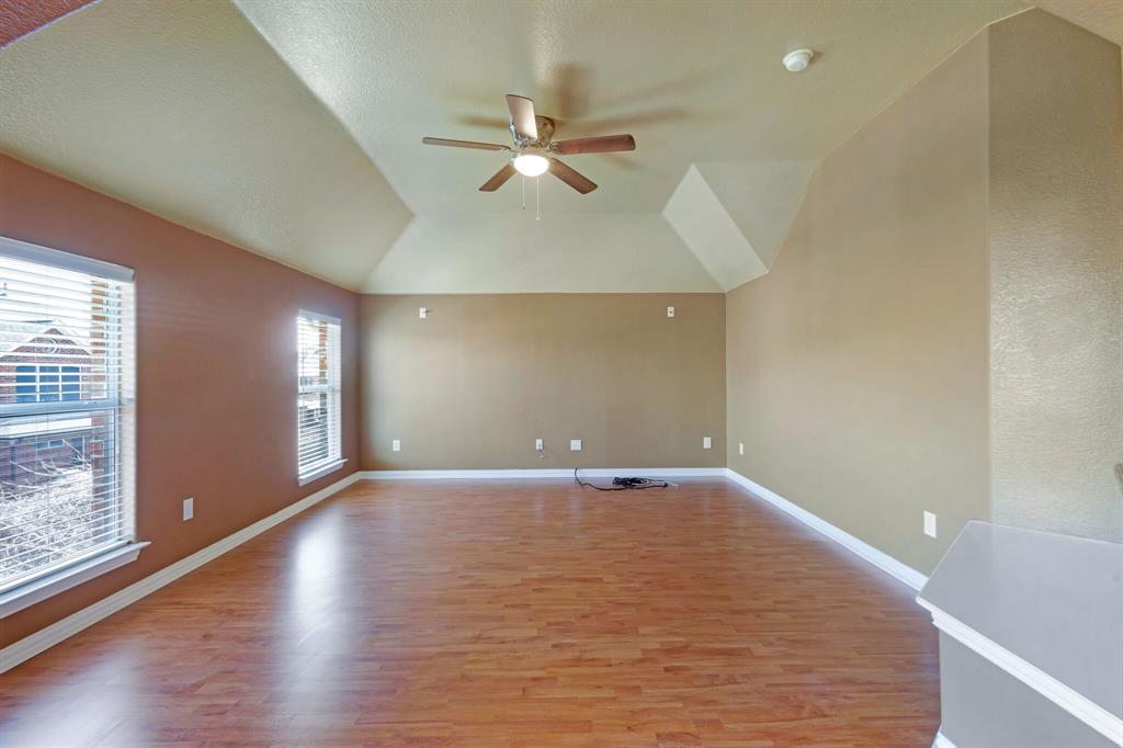 9618 Peach Tree Lane Rowlett, TX 75089 - Photo 32 of 40 wooden floor in an empty room with a window