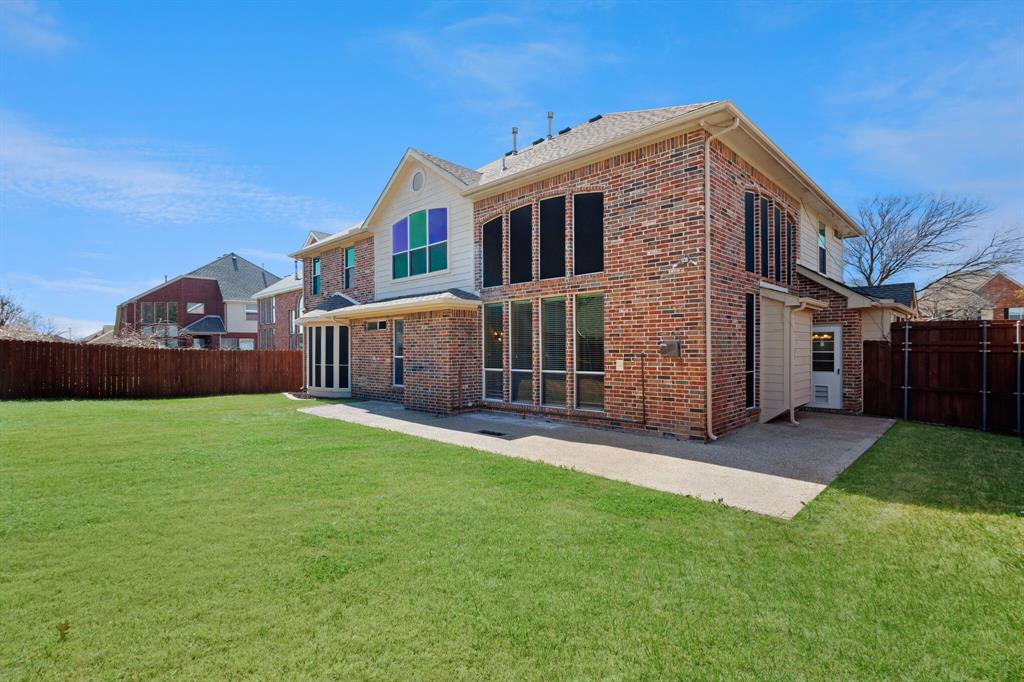 9618 Peach Tree Lane Rowlett, TX 75089 - Photo 39 of 40 a view of an house with backyard and garden