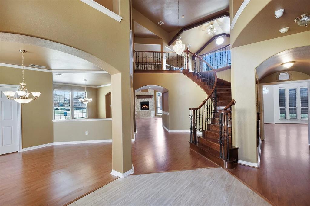 9618 Peach Tree Lane Rowlett, TX 75089 - Photo 4 of 40 a view of entryway and hall with wooden floor