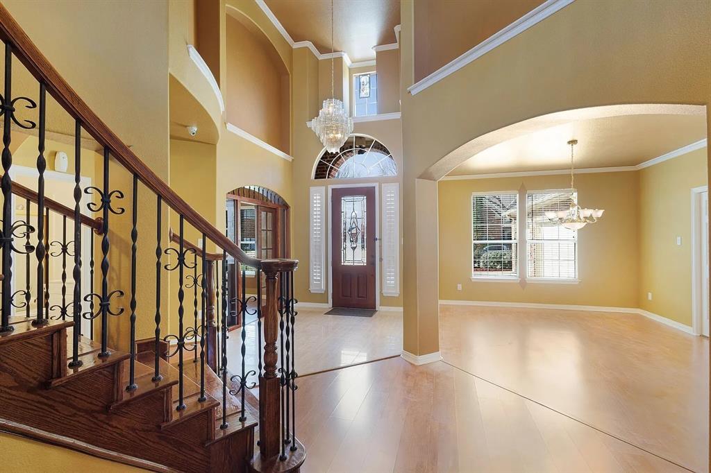 9618 Peach Tree Lane Rowlett, TX 75089 - Photo 5 of 40 a view of entryway and hall with wooden floor