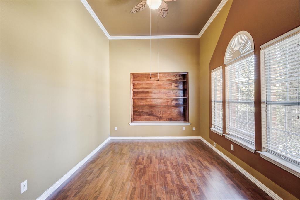 9618 Peach Tree Lane Rowlett, TX 75089 - Photo 9 of 40 a view of empty room with wooden floor and fan