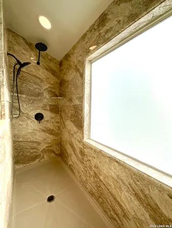 a view of a room with racks and windows