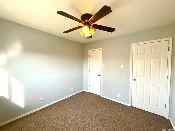 a view of a balcony with wooden floor and floor to ceiling window