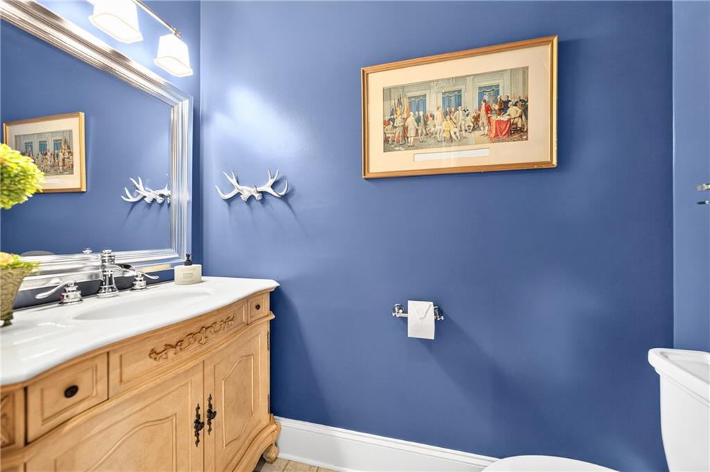 486 Settler Road Ligonier, PA 15658 - Photo 18 of 49 Main Level Powder Room has been completely revamped, all new vanity, fixitures, mirror, glass shelf.