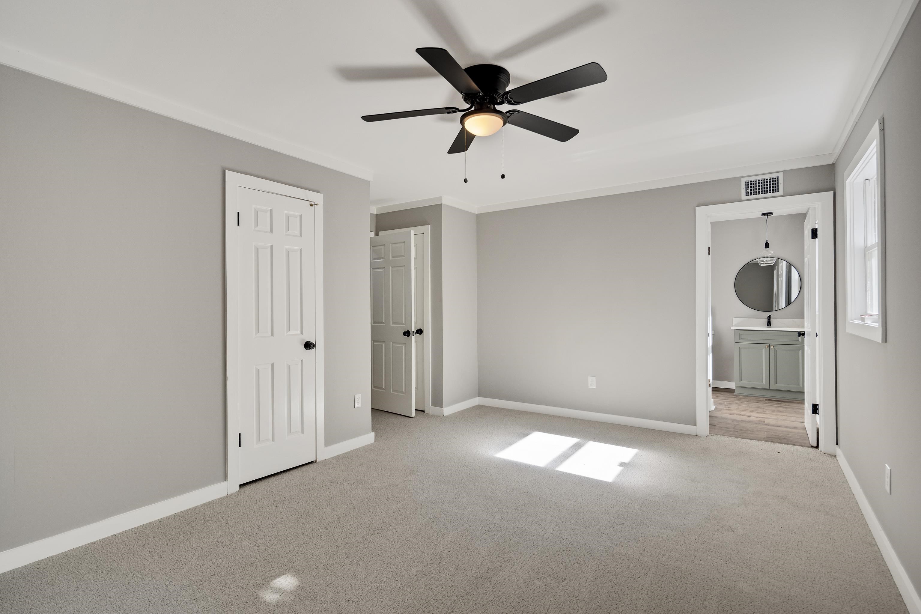 6380 Kirby Ridge Cove Memphis, TN 38119 - Photo 23 of 40 Unfurnished bedroom with carpet, ornamental molding, ensuite bath, and ceiling fan