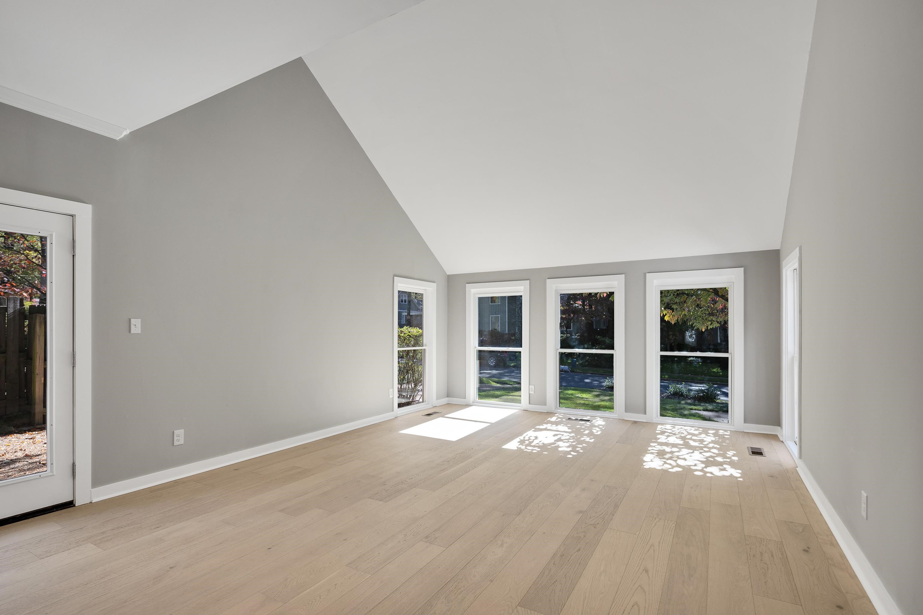 6380 Kirby Ridge Cove Memphis, TN 38119 - Photo 4 of 40 Unfurnished living room featuring high vaulted ceiling and light wood-style flooring