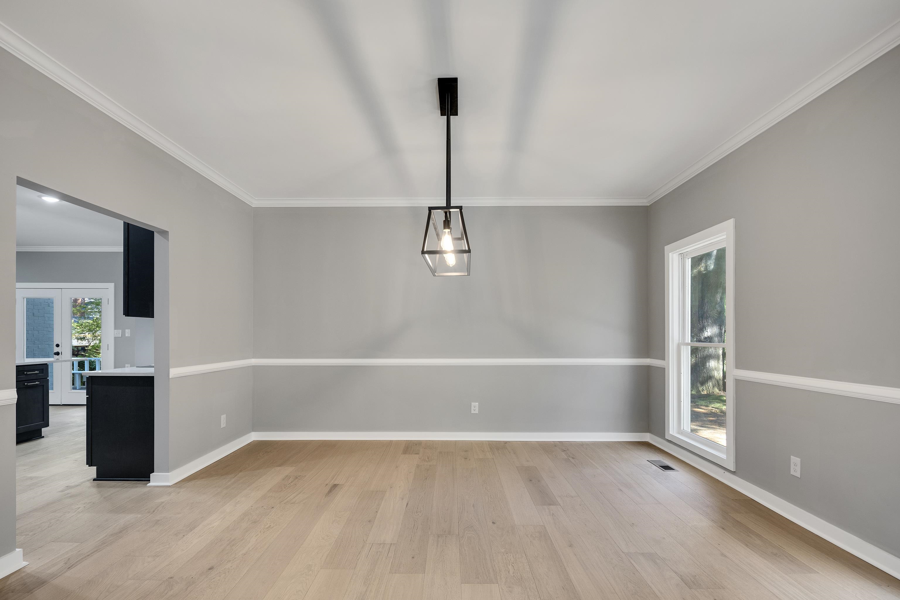6380 Kirby Ridge Cove Memphis, TN 38119 - Photo 7 of 40 Unfurnished dining area with crown molding, light wood finished floors, and french doors